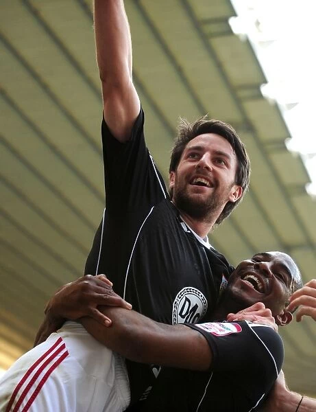 Bristol City's Double Delight: Cole Skuse and Marvin Elliott Celebrate Second Goal Against Derby County (30th April 2011, Championship)