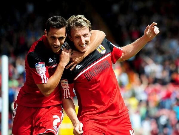 Bristol City's Double Delight: Woolford and Baldock Celebrate Goals Against Cardiff City (August 2012)