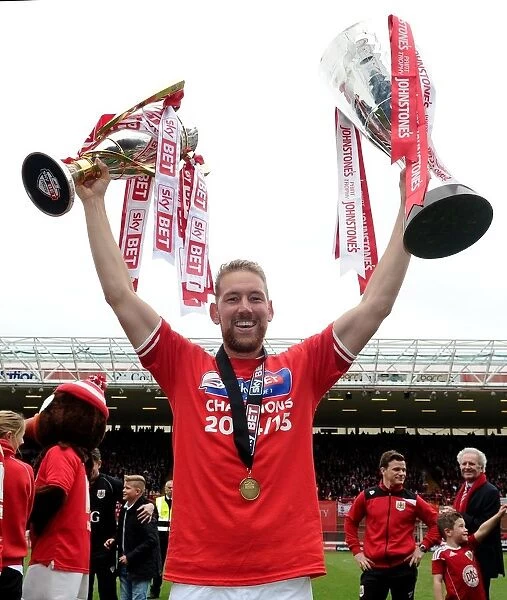 Bristol City's Double Triumph: Scott Wagstaff Celebrates with League One and JPT Trophies at Ashton Gate (May 2015)