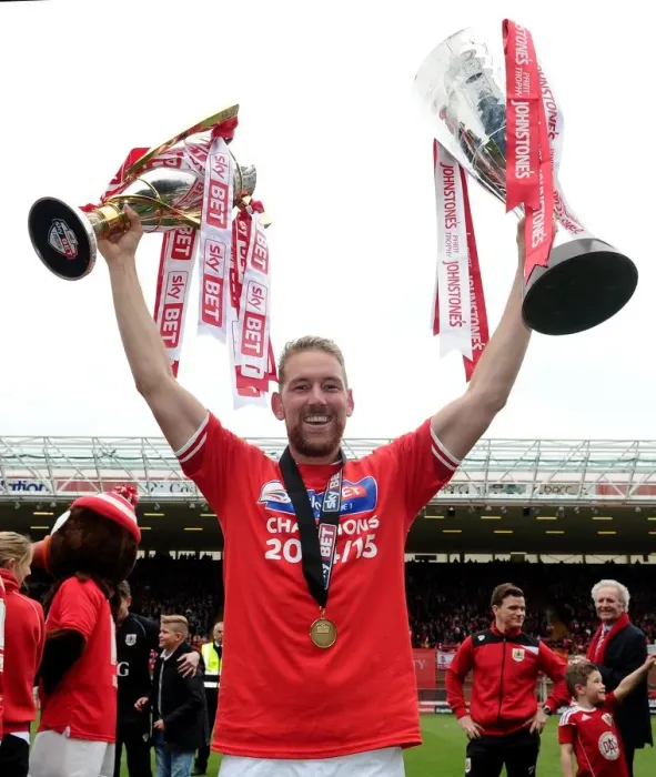 Framed Print : Bristol City's Double Triumph: Scott Wagstaff Celebrates with League One and JPT Trophies at Ashton Gate (May 2015) Framed Print : Bristol City's Double Triumph: Scott Wagstaff Celebrates with League One and JPT Trophies at Ashton Gate (May 2015)