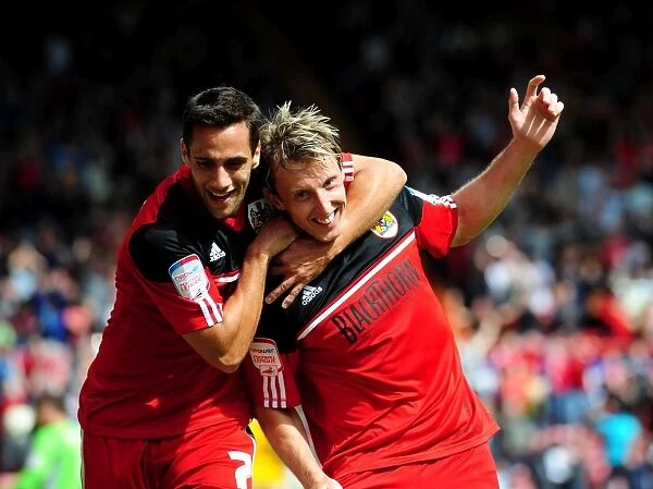 Bristol City's Double Trouble: Woolford and Baldock Celebrate Goals Against Cardiff City, 2012