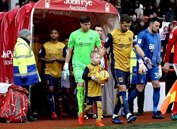 Bristol City's Gary O'Neil and Young Mascot Lead Team Out at The City Ground (Nottingham Forest vs. Bristol City, Sky Bet Championship)
