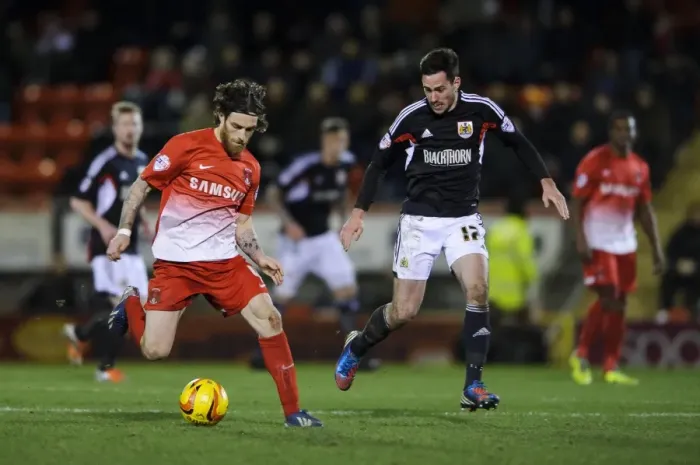 Framed Print : Bristol City's Greg Cunningham Challenges Leyton Orient's Romain Vincelot in Football Rivalry Framed Print : Bristol City's Greg Cunningham Challenges Leyton Orient's Romain Vincelot in Football Rivalry