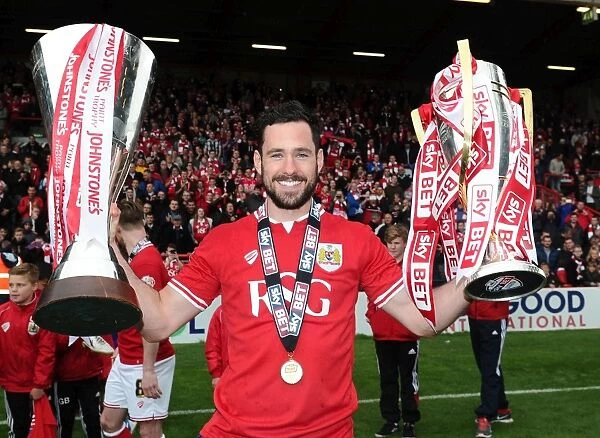 Bristol City's Greg Cunningham Lifts Sky Bet League One and JPT Trophies after Winning Double