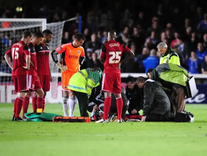 Framed Print : Bristol City's Greg Cunningham Receives Treatment During Peterborough United Match Framed Print : Bristol City's Greg Cunningham Receives Treatment During Peterborough United Match