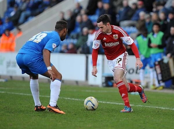 Bristol City's Greg Cunningham vs. Colchester United's Alie Sesay: Intense Moment from the Colchester United v Bristol City Football Match, Sky Bet League One (March 22, 2014)