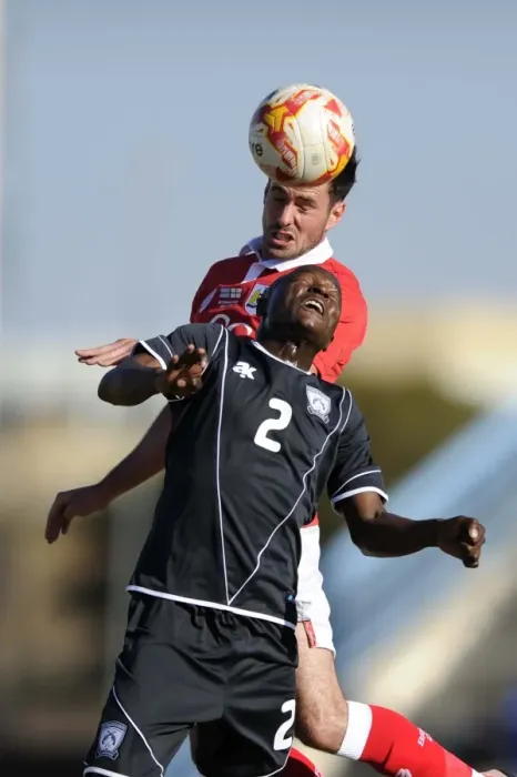 Framed Print : Bristol City's Greg Cunningham vs Extension Gunners Isaac Paete: A Heading Battle in Botswana, 2014 Framed Print : Bristol City's Greg Cunningham vs Extension Gunners Isaac Paete: A Heading Battle in Botswana, 2014