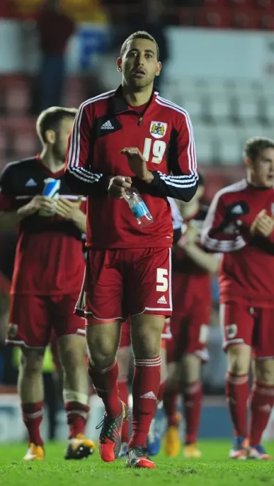 Framed Print : Bristol City's Heartbreaking Moment: Lewin Nyatanga Leaves the Field After Relegation against Birmingham City (16-04-2013)