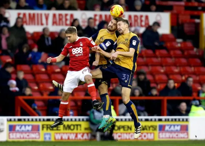 Framed Print : Bristol City's Hegeler and Wright Outmuscle Nottingham Forest's Ward for Header in Sky Bet Championship Clash