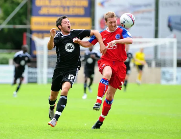 Framed Print : Bristol Citys Ivan Sproule battles for the ball with Aldershots Jamie Vincent Framed Print : Bristol Citys Ivan Sproule battles for the ball with Aldershots Jamie Vincent
