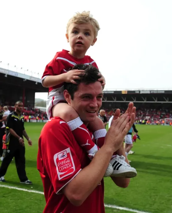 Framed Print : Bristol City's Ivan Sproule and Son: A Heartwarming Moment at Ashton Gate Stadium (Bristol City v Derby County, Championship, 2010)
