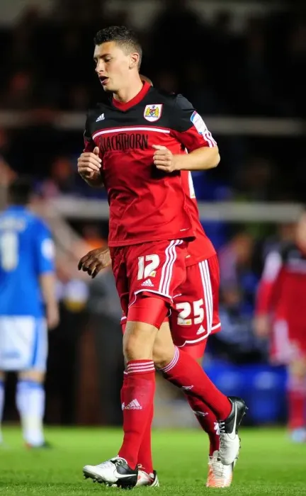 Framed Print : Bristol City's James Wilson Faces Off Against Peterborough United in Championship Clash