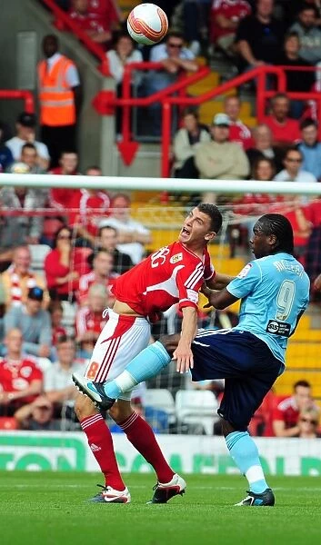 Bristol City's James Wilson Foul by Hull City's Aaron Mclean in Championship Match - September 2011