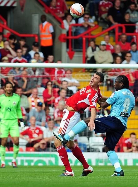 Bristol City's James Wilson Fouled by Hull City's Aaron Mclean in Championship Match, September 2011 - Editorial Use Only