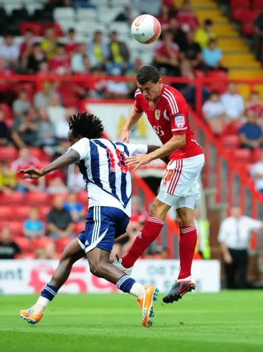 Framed Print : Bristol City's James Wilson Outjumps Somen Tchoyi in Championship Clash vs. West Brom, 2011 Framed Print : Bristol City's James Wilson Outjumps Somen Tchoyi in Championship Clash vs. West Brom, 2011