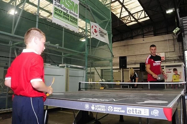 Bristol City's James Wilson Plays Table Tennis with Young Fan at Ashton Gate