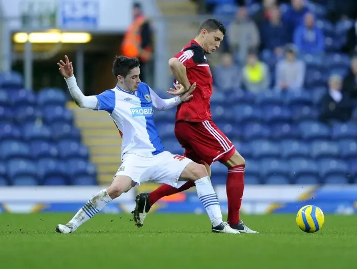 Framed Print : Bristol City's James Wilson Tackles Diogo Rosado in FA Cup Clash at Ewood Park