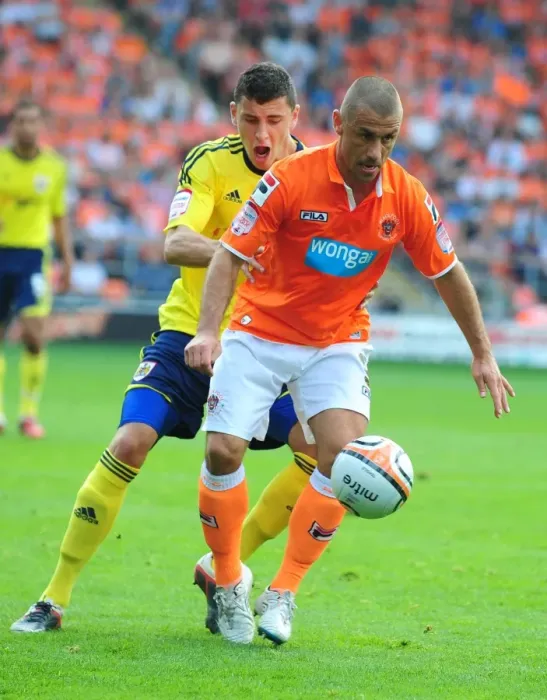 Framed Print : Bristol City's James Wilson vs. Blackpool's Kevin Phillips: Battle for the Ball in 2011 League Cup Match Framed Print : Bristol City's James Wilson vs. Blackpool's Kevin Phillips: Battle for the Ball in 2011 League Cup Match