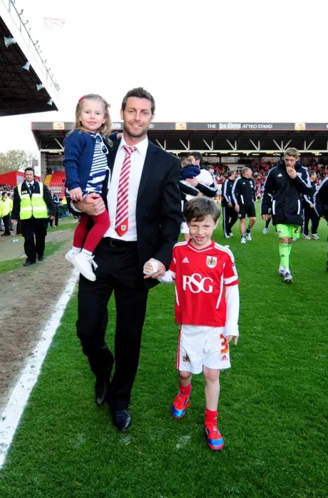 Framed Print : Bristol City's Jamie McAllister and Children: A Heartwarming Moment at Ashton Gate Stadium (Bristol City v Barnsley, 2012) Framed Print : Bristol City's Jamie McAllister and Children: A Heartwarming Moment at Ashton Gate Stadium (Bristol City v Barnsley, 2012)