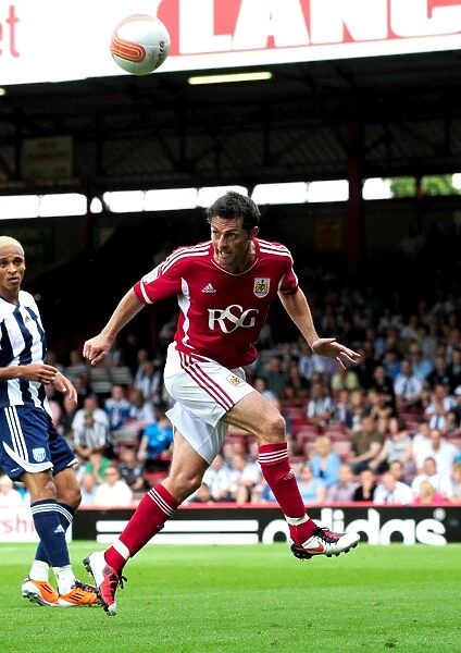 Bristol City's Jamie McAllister Clears the Ball in Championship Clash Against West Brom, 2011