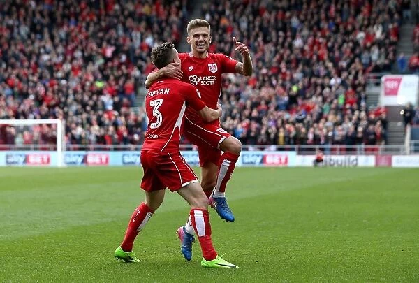 Bristol City's Jamie Paterson and Joe Bryan: Celebrating a 2-0 Goal Against Queens Park Rangers