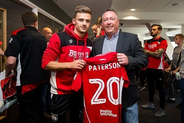 Bristol City's Jamie Paterson Presents Sponsors with Signed Shirt after Championship Match against Birmingham City