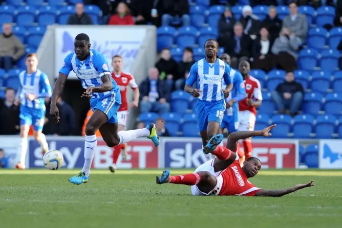 Framed Print : Bristol City's Jay Emmanuel-Thomas Contests the Ball with Colchester United's Magnus Okuonghae - Football Rivalry in League One Framed Print : Bristol City's Jay Emmanuel-Thomas Contests the Ball with Colchester United's Magnus Okuonghae - Football Rivalry in League One