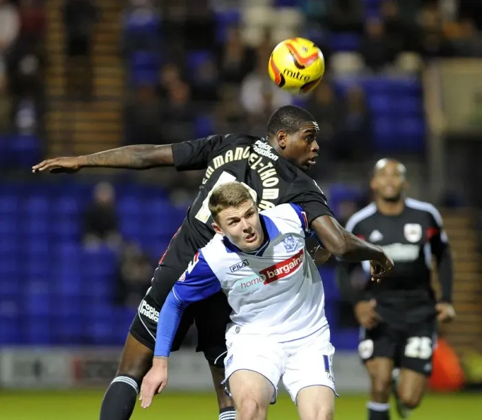 Framed Print : Bristol City's Jay Emmanuel-Thomas Fights for the Header in Tranmere vs. Bristol City Football Match, Sky Bet League One (November 16, 2013)