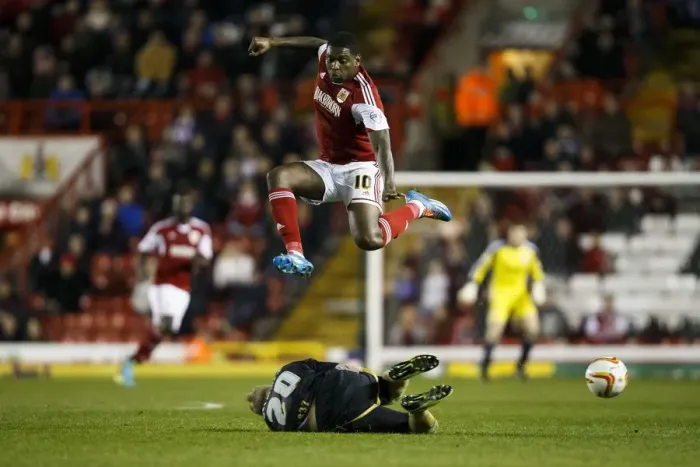 Framed Print : Bristol City's Jay Emmanuel-Thomas Leaps Over Port Vale's Jack Grimmer in Sky Bet League One Clash