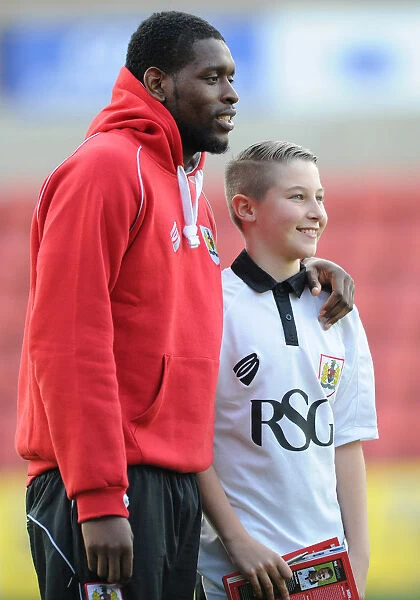 Bristol City's Jay Emmanuel-Thomas and Mascot Celebrate Sky Bet League One Victory at Swindon Town's County Ground