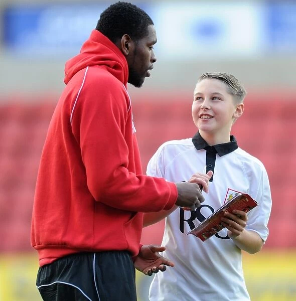 Bristol City's Jay Emmanuel-Thomas and Mascot Celebrate Victory at Swindon Town's County Ground