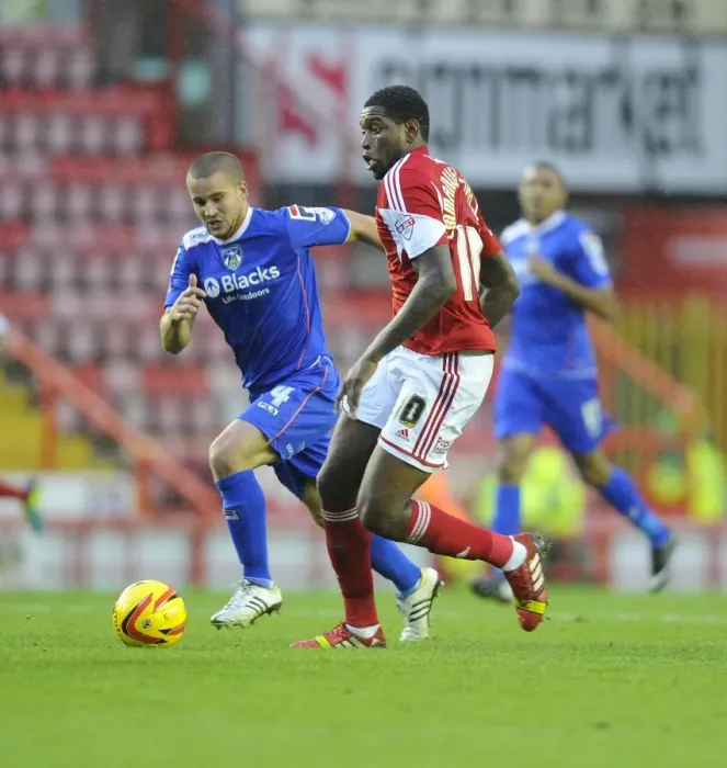 Framed Print : Bristol City's Jay Emmanuel-Thomas Outmaneuvers Oldham Athletic's James Wesolowski in Sky Bet League One Clash Framed Print : Bristol City's Jay Emmanuel-Thomas Outmaneuvers Oldham Athletic's James Wesolowski in Sky Bet League One Clash