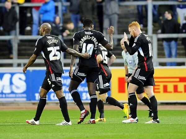 Bristol City's Jay Emmanuel-Thomas Scores and Celebrates at Brunton Park against Carlisle United