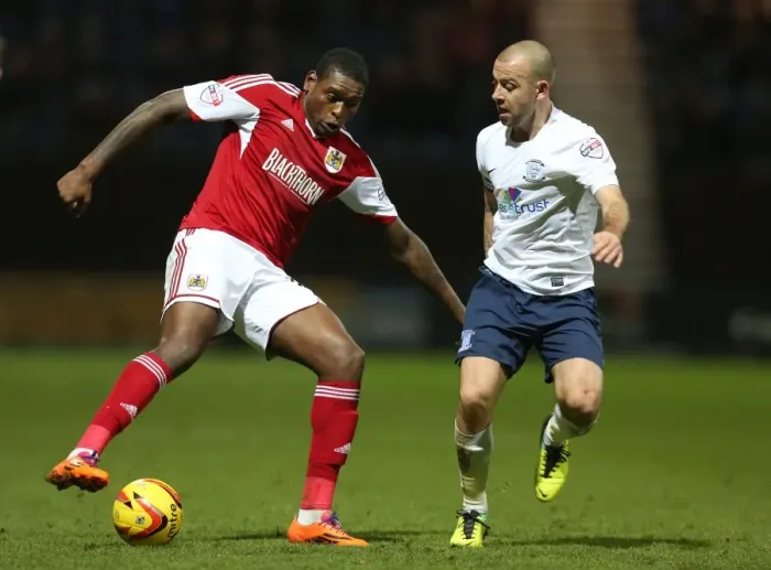 Framed Print : Bristol City's Jay Emmanuel-Thomas vs. Preston North End's Keith Keane - Intense Battle on the Field