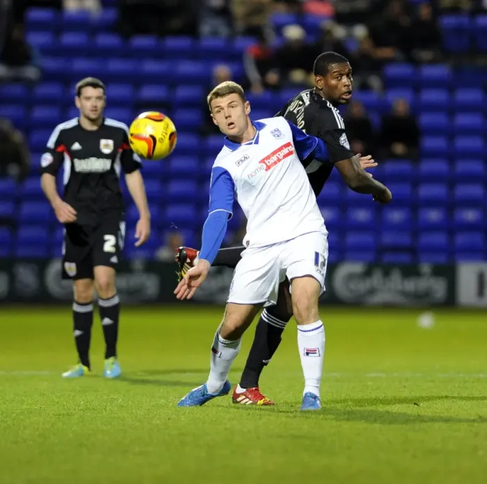 Framed Print : Bristol City's Jay Emmanuel-Thomas vs Tranmere's Max Power in Sky Bet League One Clash at Prenton Park Framed Print : Bristol City's Jay Emmanuel-Thomas vs Tranmere's Max Power in Sky Bet League One Clash at Prenton Park