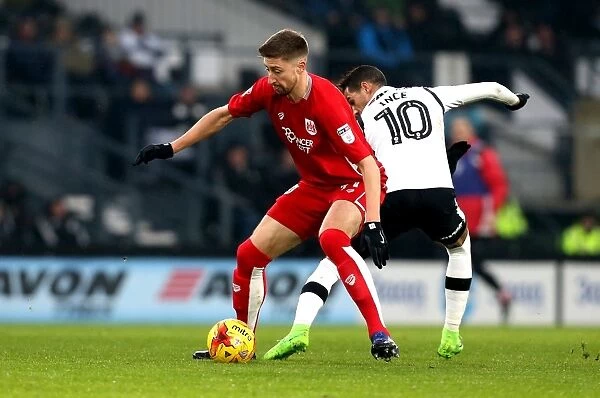 Bristol City's Jens Hegeler Dashes Past Derby County's Thomas Ince