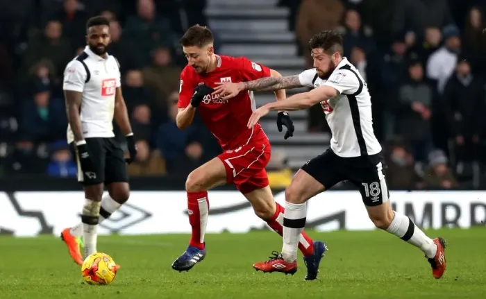 Framed Print : Bristol City's Jens Hegeler Outmaneuvers Derby County's Jacob Butterfield Framed Print : Bristol City's Jens Hegeler Outmaneuvers Derby County's Jacob Butterfield