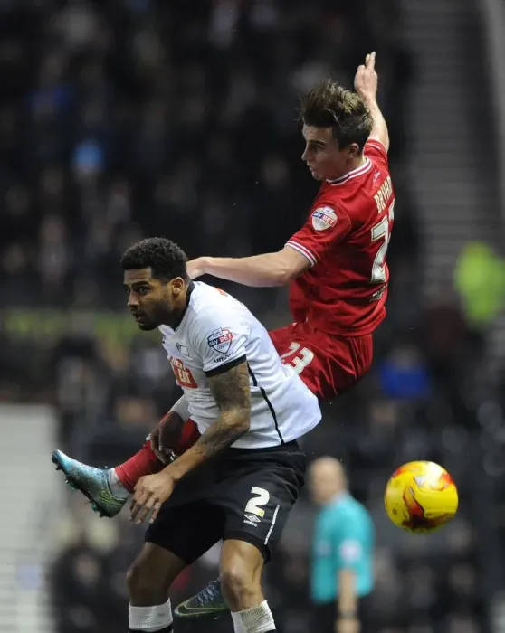 Framed Print : Bristol City's Joe Bryan Battles for a Header Against Derby County's Cyrus Christie Framed Print : Bristol City's Joe Bryan Battles for a Header Against Derby County's Cyrus Christie