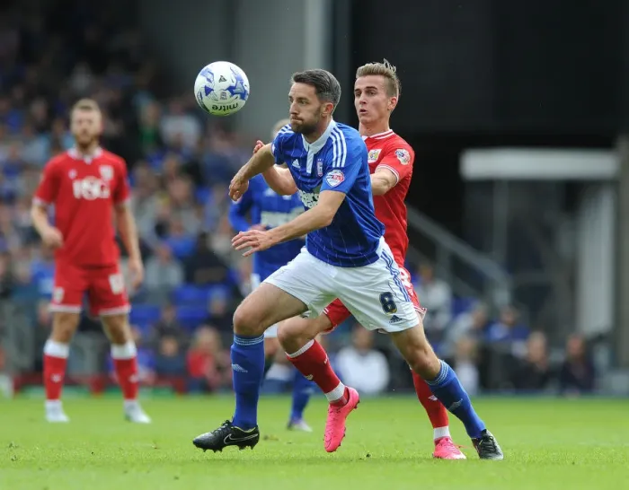 Framed Print : Bristol City's Joe Bryan Closes In on Former Teammate Cole Skuse in Ipswich Derby Framed Print : Bristol City's Joe Bryan Closes In on Former Teammate Cole Skuse in Ipswich Derby
