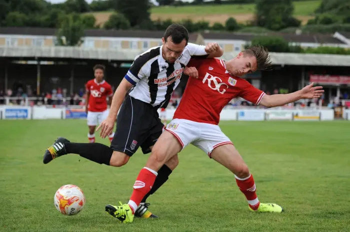 Framed Print : Bristol City's Joe Bryan Faces Off Against Bath City's Andy Gallinagh in Pre-Season Friendly