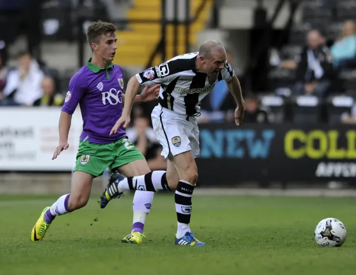 Framed Print : Bristol City's Joe Bryan Faces Off Against Notts County's Gary Jones in Sky Bet League One Clash Framed Print : Bristol City's Joe Bryan Faces Off Against Notts County's Gary Jones in Sky Bet League One Clash