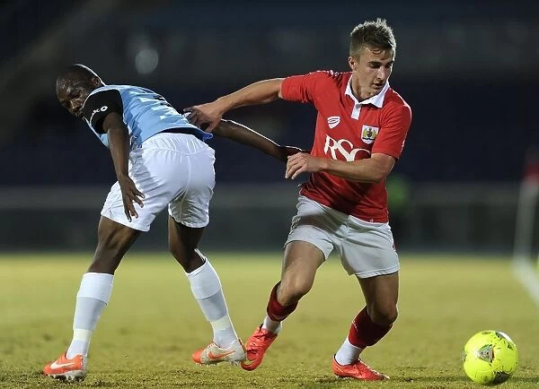 Bristol City's Joe Bryan Fights for Possession in 2014 Botswana Tour Match