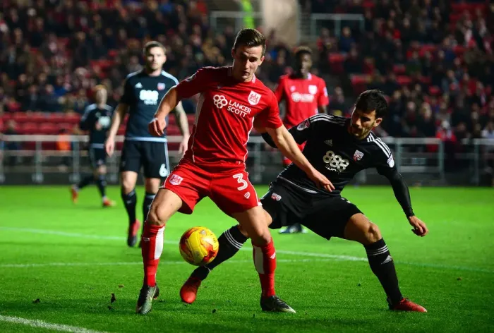 Framed Print : Bristol City's Joe Bryan Holds Off Brentford's Maxime Colin during Sky Bet Championship Match Framed Print : Bristol City's Joe Bryan Holds Off Brentford's Maxime Colin during Sky Bet Championship Match