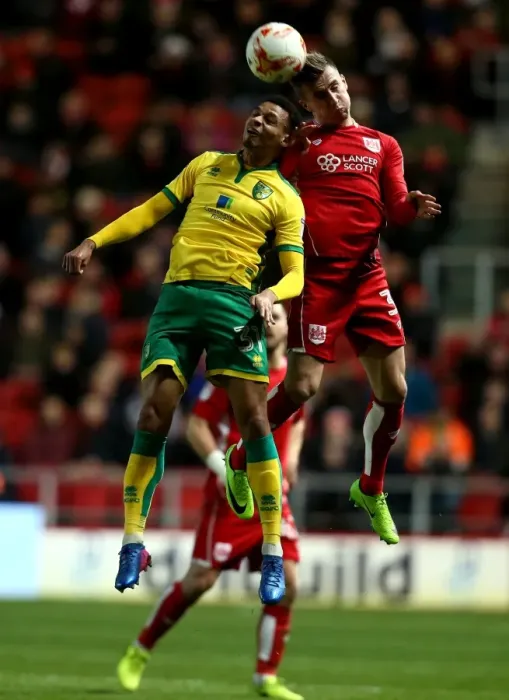 Framed Print : Bristol City's Joe Bryan Outjumps Norwich City's Josh Murphy for a Header at Ashton Gate