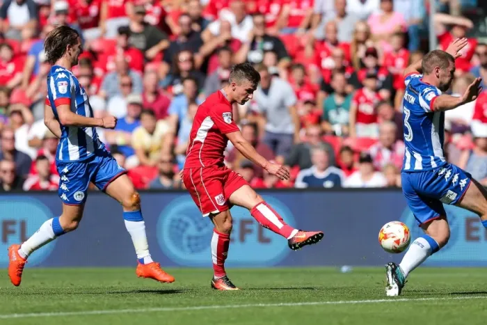 Framed Print : Bristol City's Joe Bryan Scores Past Wigan Athletic's Jake Buxton at Ashton Gate Stadium Framed Print : Bristol City's Joe Bryan Scores Past Wigan Athletic's Jake Buxton at Ashton Gate Stadium