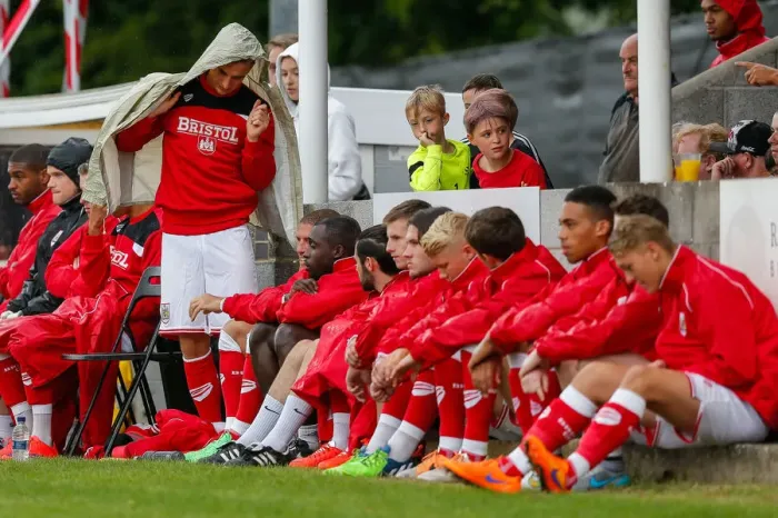 Framed Print : Bristol City's Joe Bryan Shields Himself from the Rain during Pre-Season Community Match Framed Print : Bristol City's Joe Bryan Shields Himself from the Rain during Pre-Season Community Match
