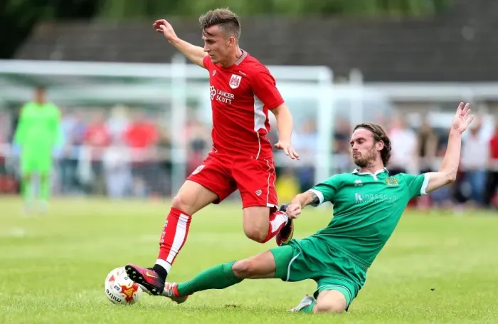 Framed Print : Bristol City's Joe Bryan Tackled by Hengrove Athletic's Asa White during Pre-season Friendly Framed Print : Bristol City's Joe Bryan Tackled by Hengrove Athletic's Asa White during Pre-season Friendly