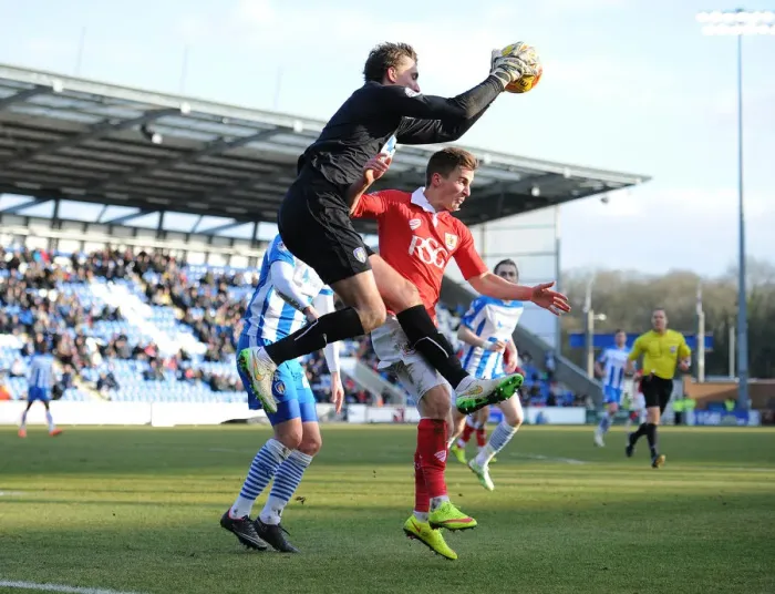 Framed Print : Bristol City's Joe Bryan Tackles Sam Walker of Colchester United - Football Rivalry in Sky Bet League One Framed Print : Bristol City's Joe Bryan Tackles Sam Walker of Colchester United - Football Rivalry in Sky Bet League One