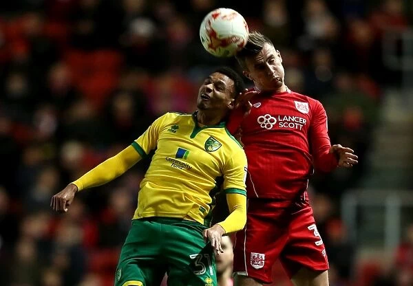 Bristol City's Joe Bryan Wins Aerial Battle Against Norwich City's Josh Murphy