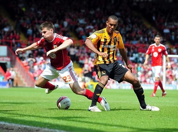 Bristol City's Joe Edwards Fights for Possession Against Hull City's Jay Simpson - Championship Clash, May 2011